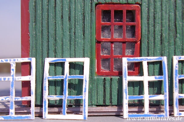 1:72 scale windows mad of polystyrene from a yoghurt cup.